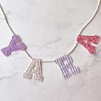 Stoffen naamslinger letters
